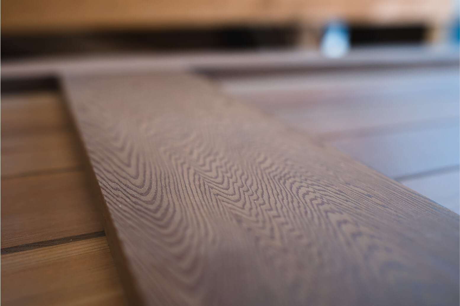 Close up photo of a treated and stained wooden plank